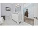 Bathroom vanity boasts marble counters, a picture window, and stylish fixtures at 820 Morrall Dr., North Myrtle Beach, SC 29582