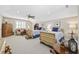 Large bedroom with two beds, sitting area, neutral walls, and a ceiling fan at 820 Morrall Dr., North Myrtle Beach, SC 29582