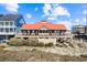 Stunning beach home with an expansive porch, perfect for enjoying ocean views and coastal breezes at 820 Morrall Dr., North Myrtle Beach, SC 29582