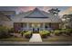 Charming single-story home with brick accents, covered front porch, and manicured landscaping at 820 Morrall Dr., North Myrtle Beach, SC 29582