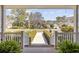 Inviting view from the front porch, showcasing the neighborhood street and manicured hedges at 820 Morrall Dr., North Myrtle Beach, SC 29582