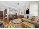 Spacious living area with a fireplace, hardwood floors, and a seamless transition to the dining area at 820 Morrall Dr., North Myrtle Beach, SC 29582