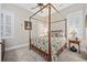 Main bedroom with a four-poster bed, neutral carpet, and a ceiling fan at 820 Morrall Dr., North Myrtle Beach, SC 29582