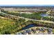 Expansive aerial view of neighborhood amenities including lakes and school near a highway at 8504 Juxa Dr., Myrtle Beach, SC 29579