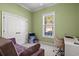 Cozy bedroom featuring a plush couch, workspace, and a sunlit window at 8504 Juxa Dr., Myrtle Beach, SC 29579