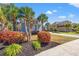 Inviting home featuring mature landscaping, palm trees, and a well-manicured lawn at 8504 Juxa Dr., Myrtle Beach, SC 29579