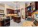 Well-equipped kitchen boasts stainless steel appliances, granite countertops, custom cabinets, and an island with a wine rack at 8504 Juxa Dr., Myrtle Beach, SC 29579