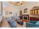 Inviting living room with a fireplace, hardwood floors, and custom built-ins at 8504 Juxa Dr., Myrtle Beach, SC 29579