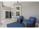 Relaxing outdoor patio with stylish blue chairs and a view of the outdoors at 8504 Juxa Dr., Myrtle Beach, SC 29579