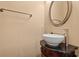 Elegant powder room features a vessel sink, granite countertop, and decorative mirror at 8504 Juxa Dr., Myrtle Beach, SC 29579