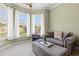 Cozy sitting area with large windows offering abundant natural light and comfortable lounge seating at 8504 Juxa Dr., Myrtle Beach, SC 29579