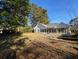 Backyard with plenty of green space and mature trees at 86 Old Barge Dr., Pawleys Island, SC 29585