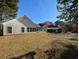 Expansive backyard with back of the home and sunroom at 86 Old Barge Dr., Pawleys Island, SC 29585