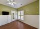 Cozy bedroom with hardwood floors, chair railing, and a bright window at 86 Old Barge Dr., Pawleys Island, SC 29585