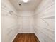 Walk-in closet features wood floors and wire shelving for ample storage at 86 Old Barge Dr., Pawleys Island, SC 29585
