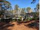 Community clubhouse featuring fenced-in area and plenty of trees at 86 Old Barge Dr., Pawleys Island, SC 29585