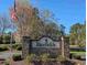The Ricefields community entrance sign, framed by lush greenery, creates a welcoming arrival at 86 Old Barge Dr., Pawleys Island, SC 29585
