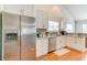 Bright kitchen with stainless steel appliances, white cabinetry, and a window overlooking the yard at 9648 Bradford Ln., Murrells Inlet, SC 29576
