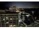 Night view of a vibrant community, with illuminated buildings and twinkling city lights at 9994 Beach Club Dr. # 1904, Myrtle Beach, SC 29572