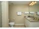 Bright bathroom featuring a granite countertop vanity with neutral wall paint and tile flooring at 9994 Beach Club Dr. # 1904, Myrtle Beach, SC 29572
