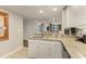 Kitchen features white cabinets, granite countertops, and an island, offering ample space for cooking and entertaining at 9994 Beach Club Dr. # 1904, Myrtle Beach, SC 29572