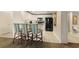 Galley-style kitchen with bar seating, white cabinets, and black appliances and tile floors at 9994 Beach Club Dr. # 1904, Myrtle Beach, SC 29572