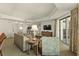 Cozy living room with plush seating, ambient lighting, and access to a balcony with picturesque ocean views at 9994 Beach Club Dr. # 1904, Myrtle Beach, SC 29572