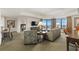 Bright and airy living room with balcony access, comfortable seating, and seamless transition to the bedroom at 9994 Beach Club Dr. # 1904, Myrtle Beach, SC 29572