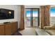 Well-appointed living area featuring a flat-screen TV, balcony access, and comfortable, stylish seating arrangements at 9994 Beach Club Dr. # 1904, Myrtle Beach, SC 29572