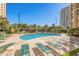 Relaxing pool area with lounge chairs, palm trees, and a clear blue swimming pool at 9994 Beach Club Dr. # 1904, Myrtle Beach, SC 29572