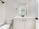 Bathroom featuring a vanity, sink, mirror, and a toilet at 1219 Inlet View Dr., North Myrtle Beach, SC 29582