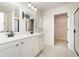 Bathroom featuring double sinks with a vanity, and a walk-in closet in view at 1219 Inlet View Dr., North Myrtle Beach, SC 29582