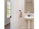 Powder room with a pedestal sink, a window with natural light, and neutral wall color at 1219 Inlet View Dr., North Myrtle Beach, SC 29582