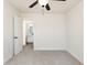 Bedroom with neutral carpet and a ceiling fan, leading to an adjoining bathroom at 1219 Inlet View Dr., North Myrtle Beach, SC 29582