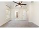 Bright, carpeted bedroom with a ceiling fan and access to the closet and bathroom at 1219 Inlet View Dr., North Myrtle Beach, SC 29582