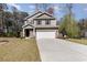 Charming two-story home with stone accents, manicured lawn, and a spacious two car driveway at 1219 Inlet View Dr., North Myrtle Beach, SC 29582