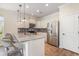 Stylish kitchen with granite island, breakfast bar, stainless steel appliances, and white cabinets at 1219 Inlet View Dr., North Myrtle Beach, SC 29582