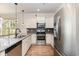 Modern kitchen featuring stainless steel appliances, granite countertops, and pendant lighting at 1219 Inlet View Dr., North Myrtle Beach, SC 29582