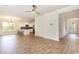 Spacious living room with wood flooring, ceiling fan, and seamless flow into the kitchen at 1219 Inlet View Dr., North Myrtle Beach, SC 29582