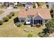 Aerial view showcasing the property, a fire pit, and a hot tub at 324 Highfield Loop, Myrtle Beach, SC 29579