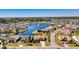 Aerial view of homes surrounding a serene lake with a fountain feature in a planned community at 324 Highfield Loop, Myrtle Beach, SC 29579