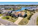 Aerial view of a beautiful brick home with lush landscaping and a long driveway at 324 Highfield Loop, Myrtle Beach, SC 29579