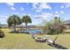 Backyard oasis with Adirondack chairs around a fire pit and serene water views at 324 Highfield Loop, Myrtle Beach, SC 29579