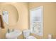 Half bath with pedestal sink, toilet, window and neutral walls at 324 Highfield Loop, Myrtle Beach, SC 29579