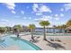 Lazy river winding through a resort-style pool area with palm trees and lakeside views at 324 Highfield Loop, Myrtle Beach, SC 29579