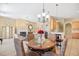 A stylish room with elegant seating, fireplace, and open layout to dining area at 324 Highfield Loop, Myrtle Beach, SC 29579