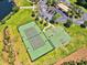 Aerial view of well-maintained community tennis and basketball courts surrounded by lush greenery at 324 Highfield Loop, Myrtle Beach, SC 29579