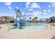 Community water park with colorful slides, shallow pool, and shaded seating areas for residents at 324 Highfield Loop, Myrtle Beach, SC 29579