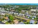 Wide aerial view of a residential neighborhood with manicured lawns, a pond, and mature trees at 361 Rycola Circle, Myrtle Beach, SC 29575