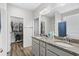 Bathroom featuring double sinks with granite countertops and a walk-in closet at 361 Rycola Circle, Myrtle Beach, SC 29575
